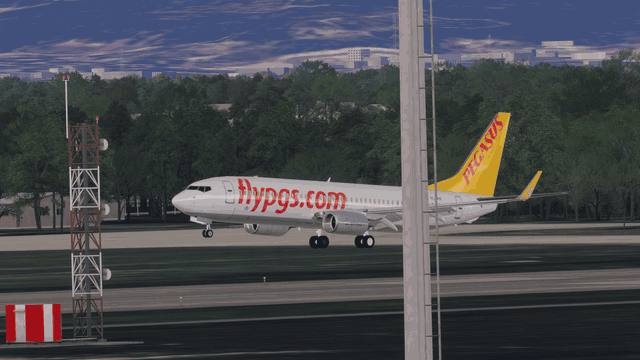 A Boeing 737 touching down and rolling out, the camera following it along the runway