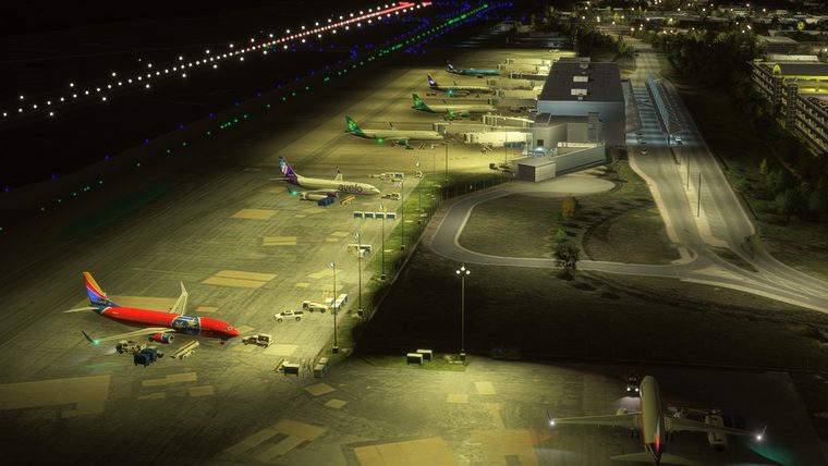 Raleigh-Durham's apron at night, a Southwest 737 at the gate under the floodlights.